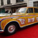 This is a replica of John Lennon's psychedelic Rolls Royce, which he bought and had painted in 1967. The original is now in a Canadian museum and this copy was made in 2014.